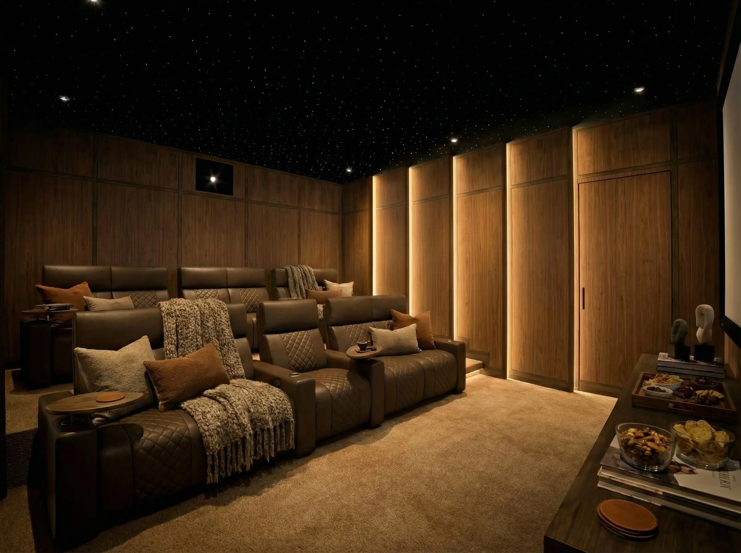 Custom home theater featuring brown leather recliners arranged in tiered stadium seating with a fiber optic star ceiling.